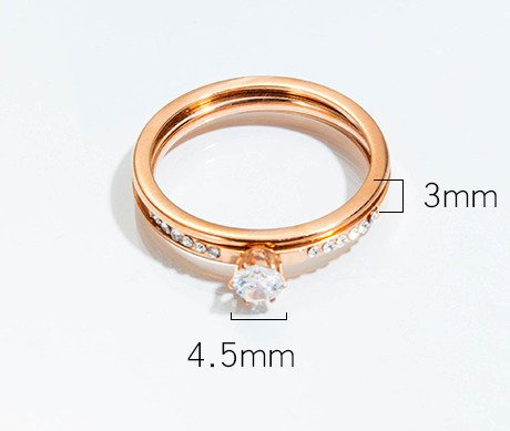 599/965 pierścionek z cyrkoniami stal różowe złoto