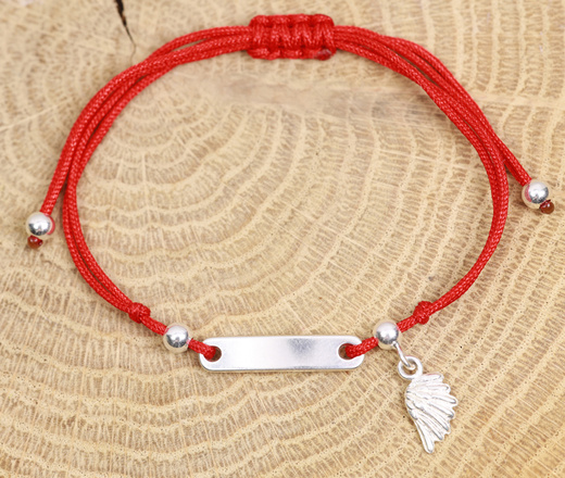 1464 bransoletka srebrna 925 ze skrzydłem grawerowana na sznureczku