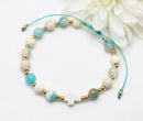  bransoletka różaniec stal złocona na sznureczku turkusowo kremowy 1877/12