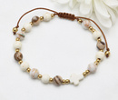  bransoletka różaniec stal złocona na sznureczku brązowo beżowy 1877/17