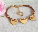 1180  bransoletka grawerowana złota srebro 925 na sznurku trzy serca