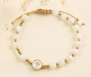 1571/15 bransoletka różaniec złota z grawerem na sznureczku z koralikami i krzyżem z masy perłowej