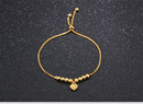 Br 599/605 BRANSOLETKA złocona ze złotymi kuleczkami i serduszkiem