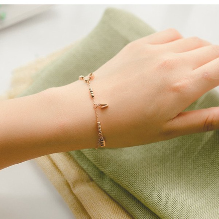 599/948 BRANSOLETKA stalowa złota z napisem LOVE