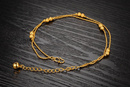 Br 599/657 BRANSOLETKA złota na stopę z kulkami
