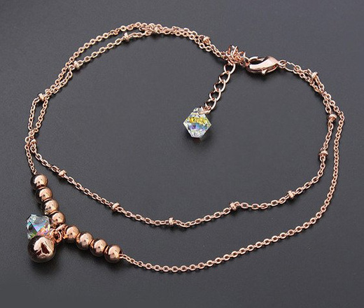 Br 599/642 BRANSOLETKA złota na stopę, podwójny łańcuszek , ze złotymi kuleczkami