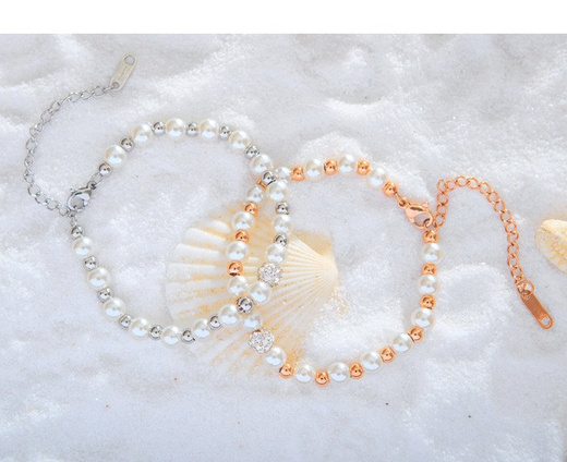 599/943 BRANSOLETKA stalowa złota perełki białe