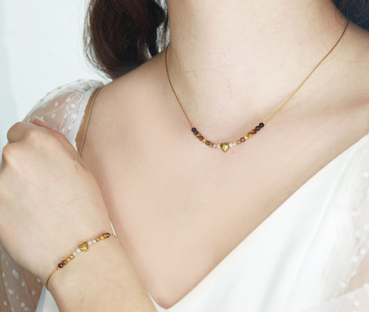 Złota bransoletka z agatem kawowym, bronzytem i tygrysim okiem 1772/1